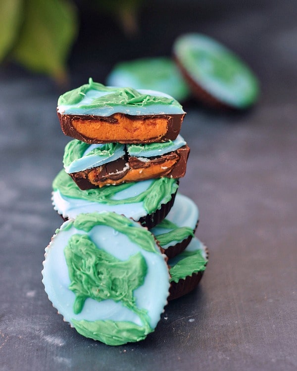 stack of peanut butter cups decorated as blue and green earths for Earth Day