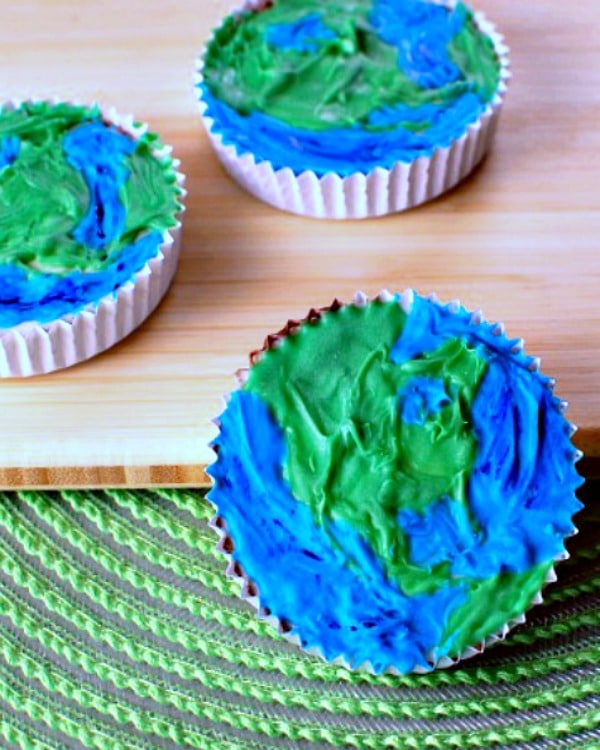 peanut butter cups decorated as blue and green earths for Earth Day