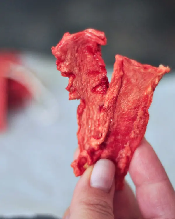 Watermelon Candy strips held in hand