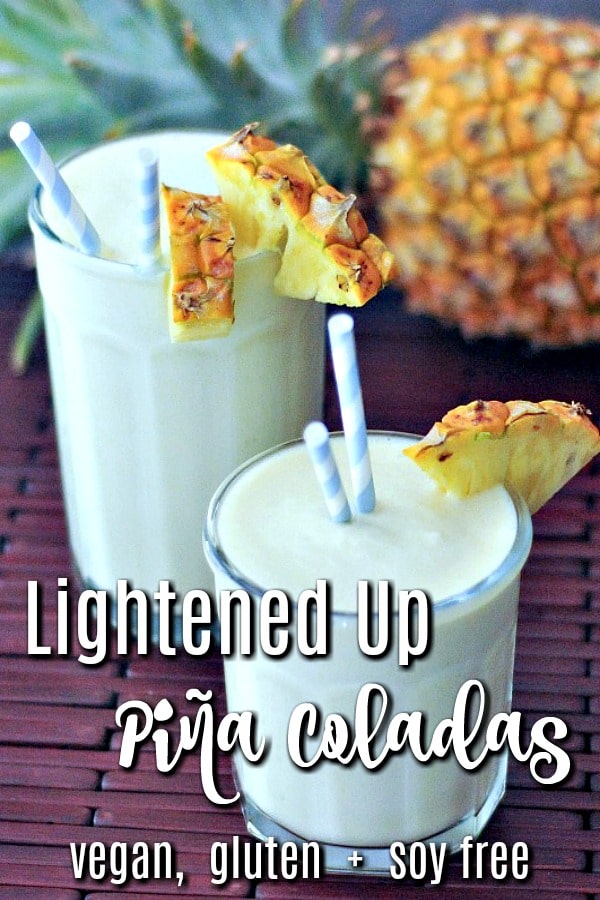 Lightened Up Pina Coladas in glasses with pineapple wedges and straws 