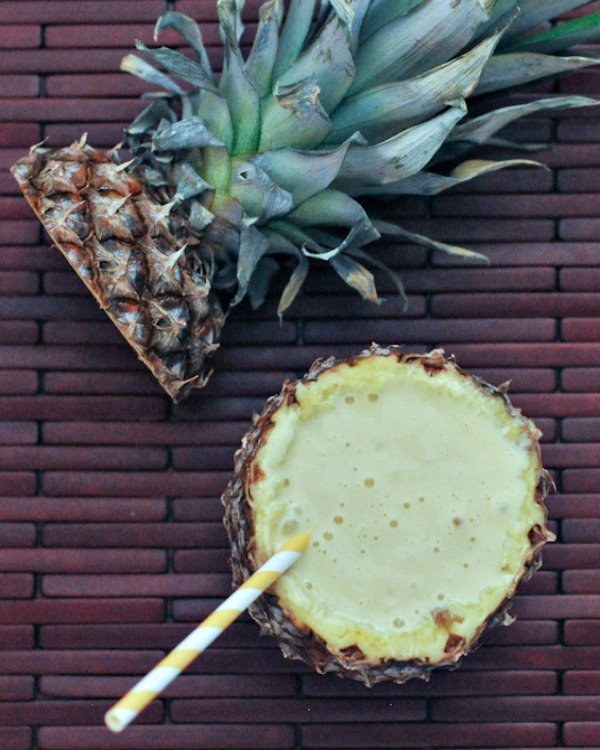 vegan cocktails! lightened up Piña Colada served in a pineapple with a striped straw