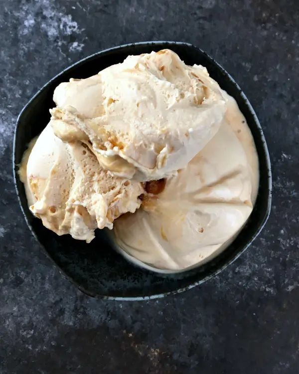 overhead view of a tan colored ginger maple miso ice cream in a bowl