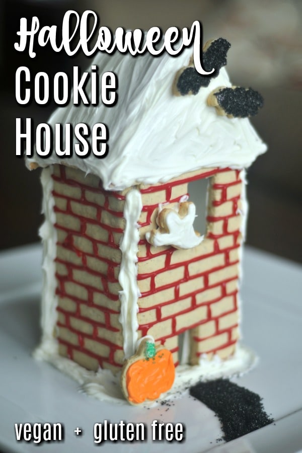 a Halloween themed cookie house, including bat, ghost, and pumpkin shaped cookies 