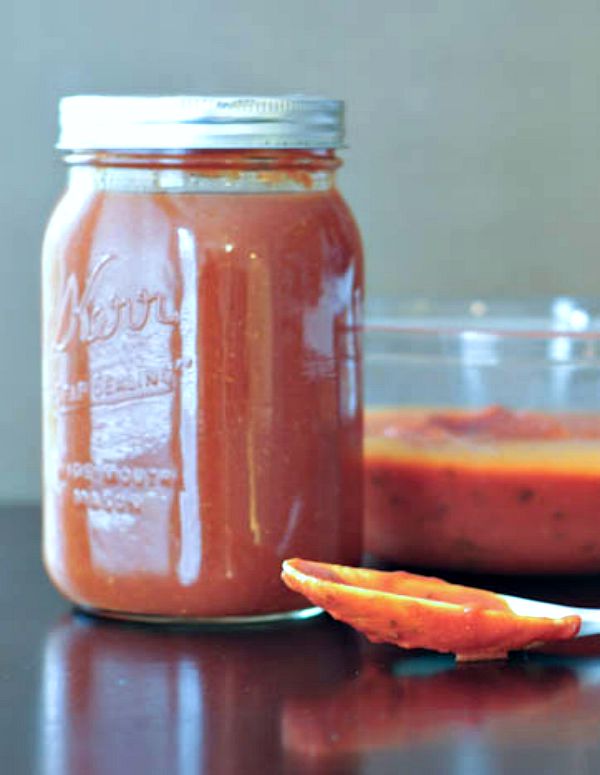 Basil marinara sauce in a large canning jar.