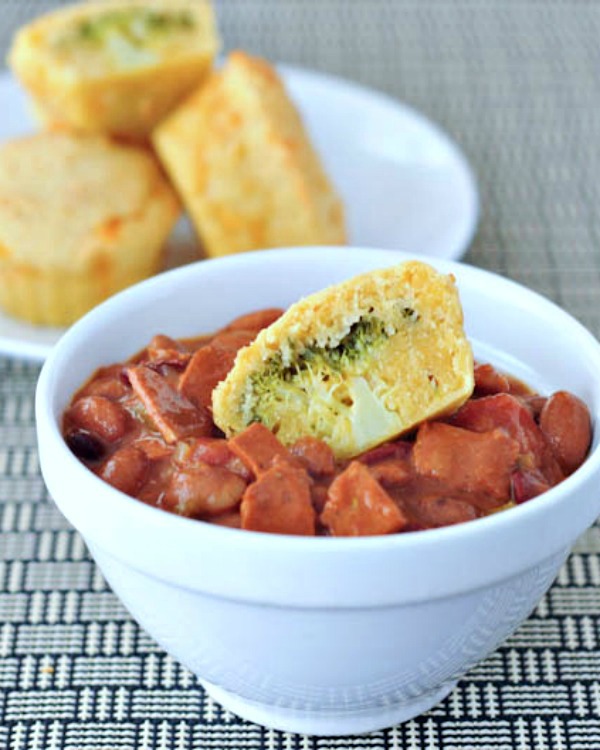 broccoli corn muffin sitting on top of bowl of chili