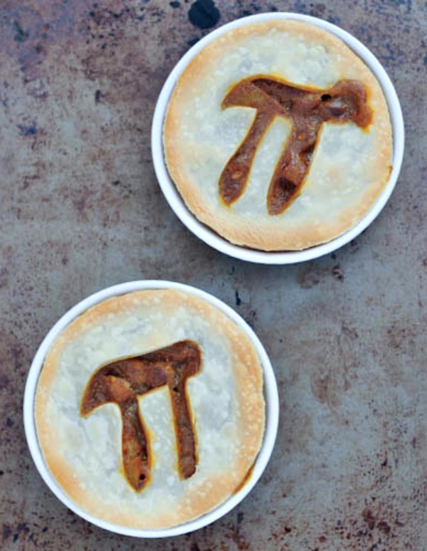 individual Spicy Potato Lentil Pies with Pi symbol cut into crust