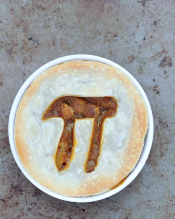 an overhead view of Vegan Pie Recipes for Pi Day: a mushroom lentil pie with a Pi symbol cut out of the crust
