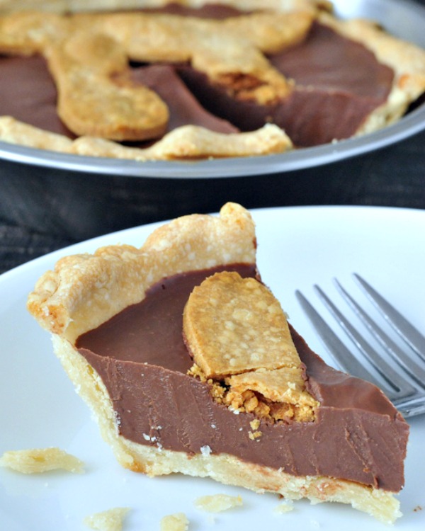 one slice of Chocolate Peanut Butter Truffle Pie on a plate