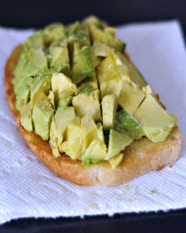 A slice of toast topped with chopped avocado.