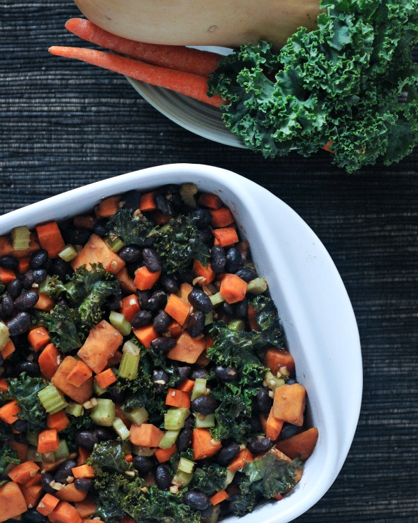 Roasted Veggie Quinoa Casserole in baking dish, whole casserole ingredients on the side