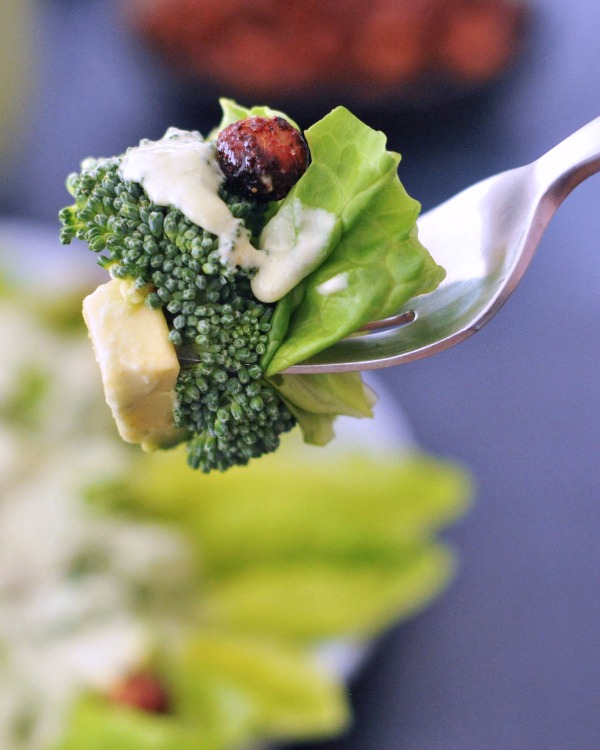 bite of Hearty Nourishing Greens Salad Vegan on a fork