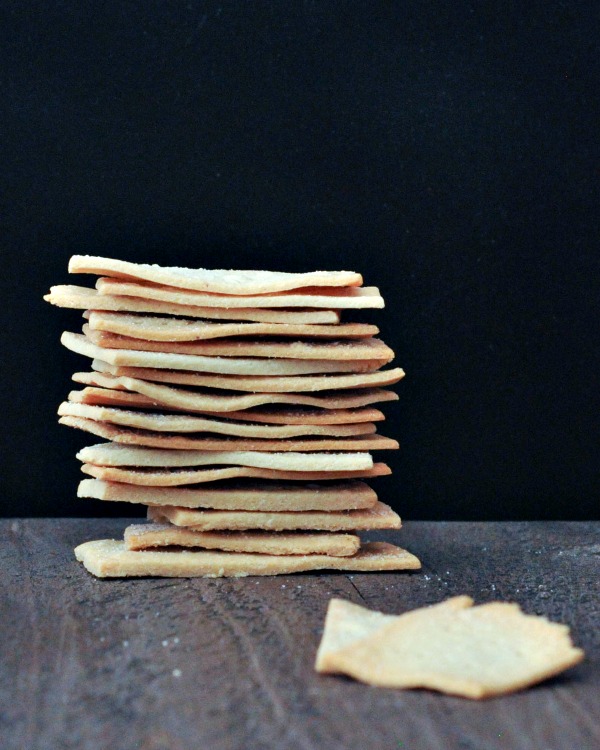 stack of Salt and Vinegar Crackers against black background