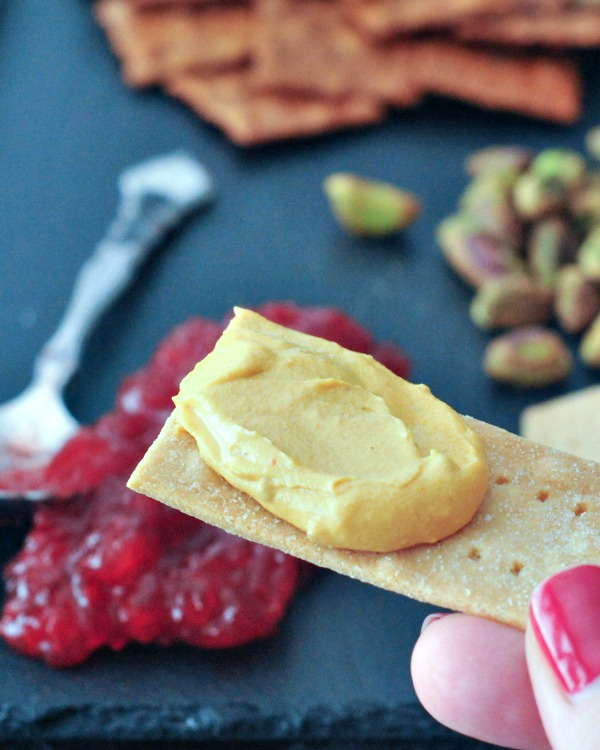 Salt and Vinegar Cracker with cheese spread on it