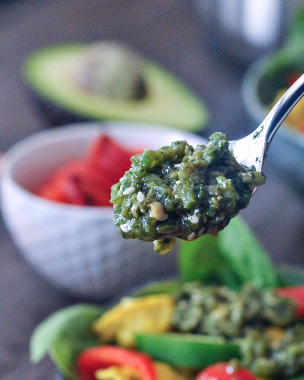 spoonful of spicy jalapeño sesame salsa, burrito bowl in background