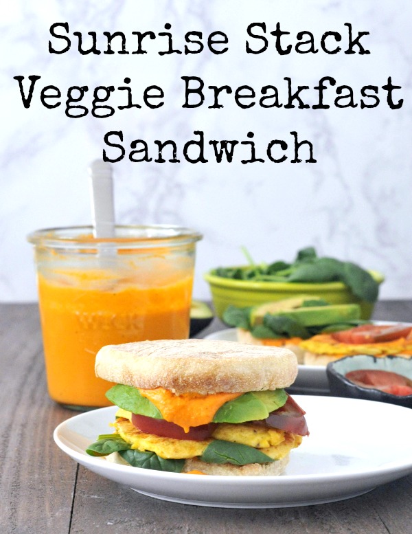 Sunrise Stack Veggie Breakfast Sandwich on a plate, romesco sauce jar in background
