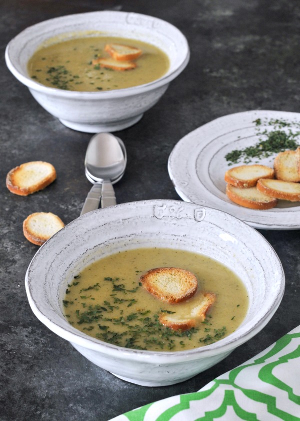 Easy One Pot Artichoke Soup in bowls with bagel chip garnish