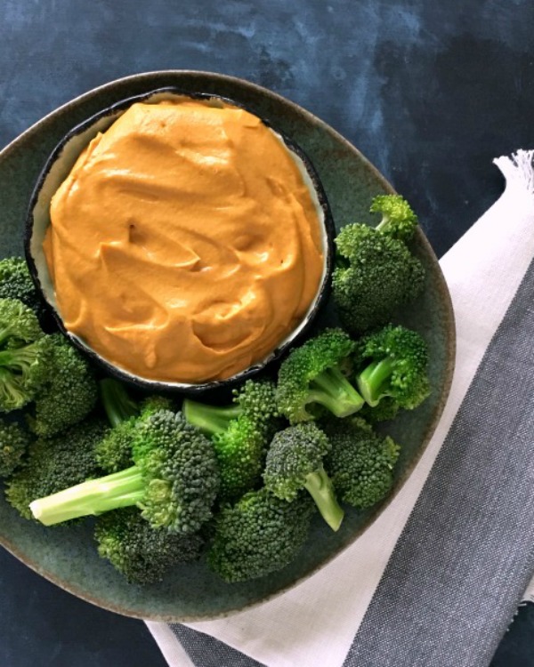 Rich Thai Dip in a bowl with Broccoli Trees on a plate