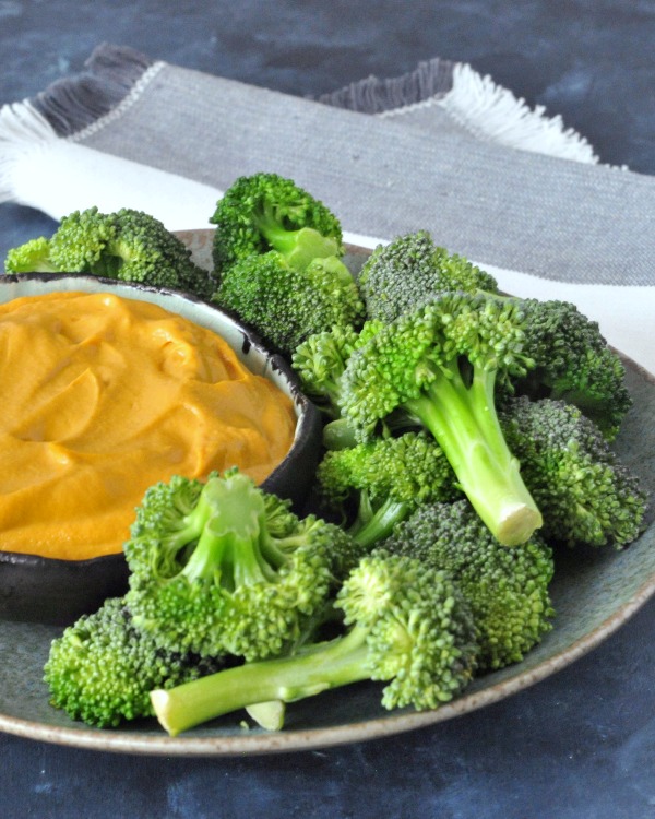 Rich Thai Dip in a bowl with Broccoli Trees on a plate