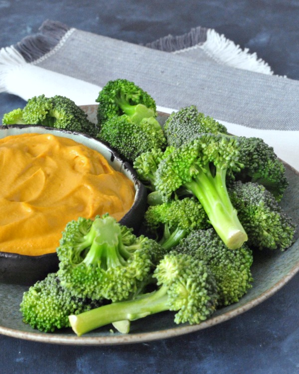 Rich Thai Dip in a bowl with Broccoli Trees on a plate