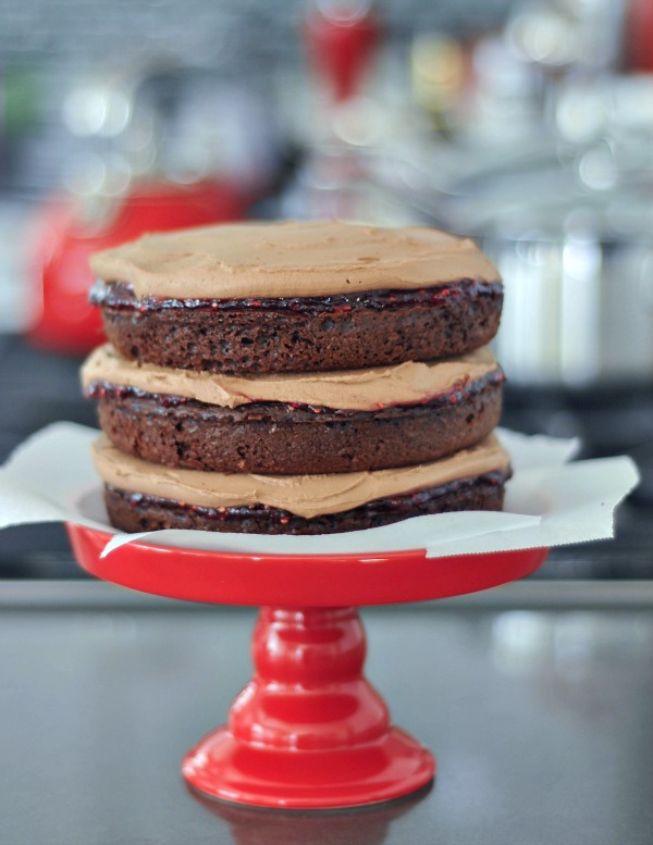 whole Delectably Rich Vegan Chocolate Mousse Cake on a cake stand