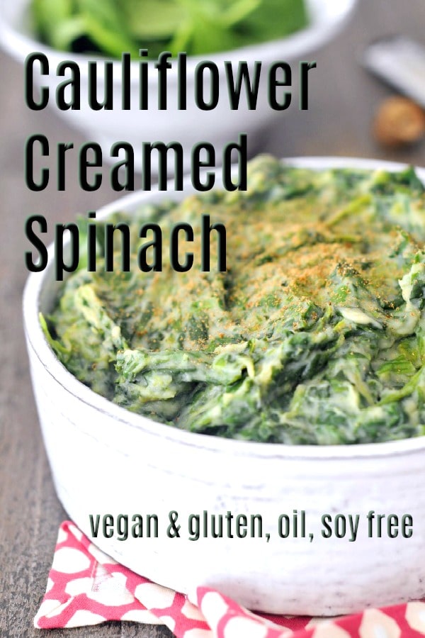 Cauliflower Creamed Spinach in a serving bowl, whole nutmeg and grater on side