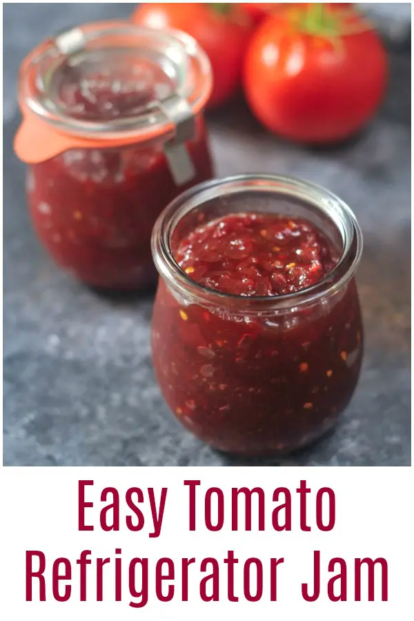 two jars of tomato jam, fresh tomatoes in background