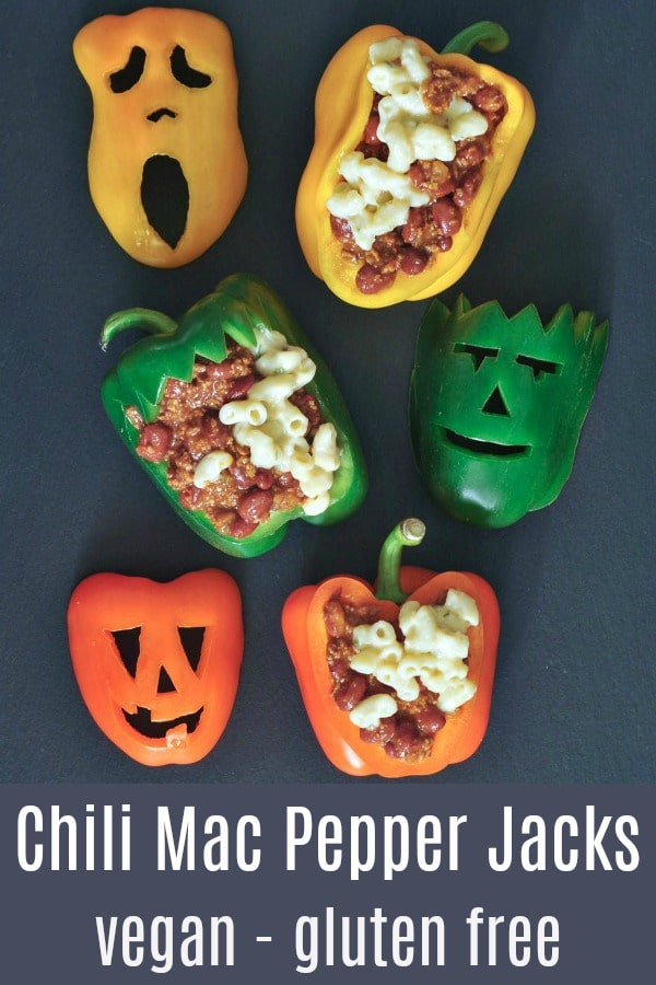 chili mac stuffed bell peppers with Halloween faces carved into the peppers