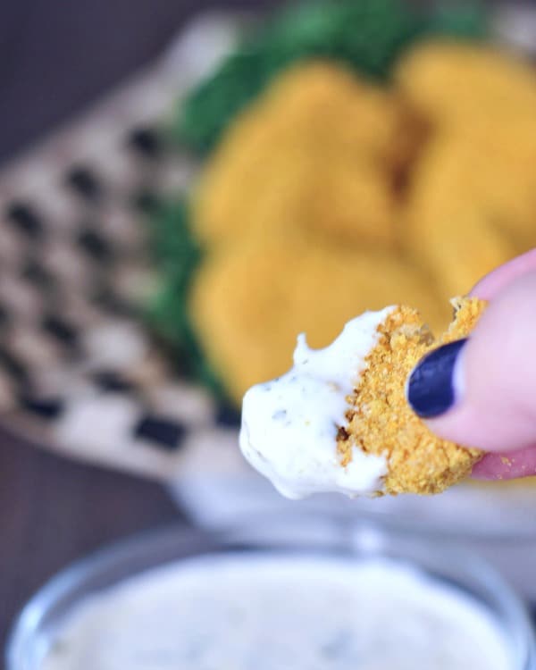Vegan chicken nugget dipped in ranch dressing