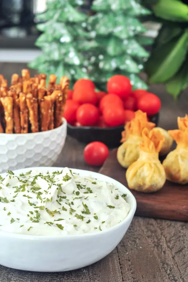 Garlic Herb Vegan Cheese Spread alongside other appetizers and veggie dippers