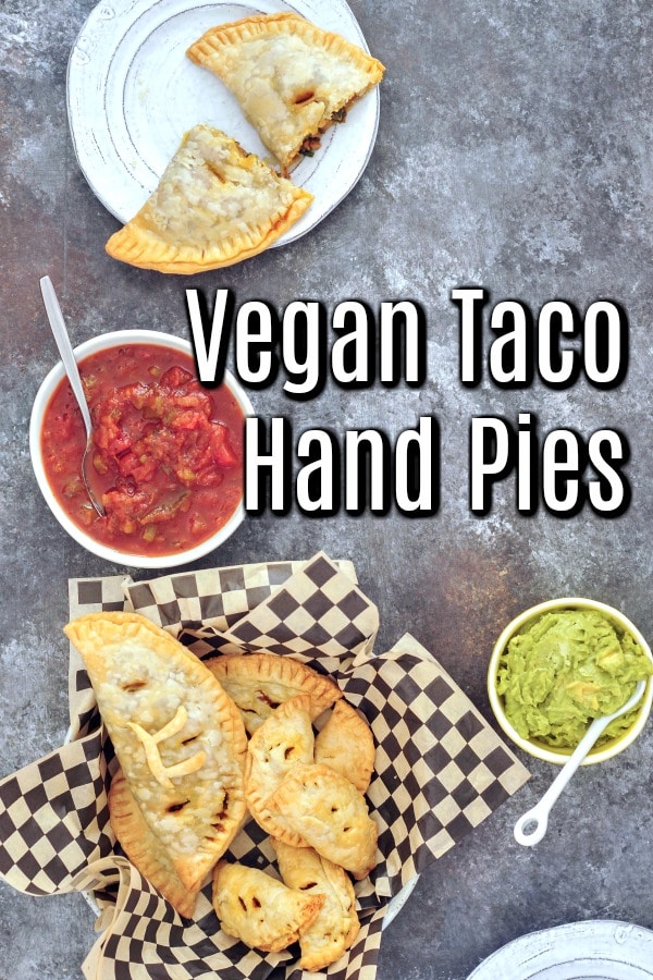Vegan Taco Hand Pies in a serving basket, one pie on a plate, salsa and guacamole as garnish 