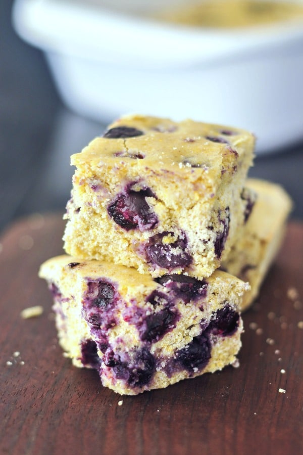 close up of two slices Blueberry Cornbread, one piece stacked on the other