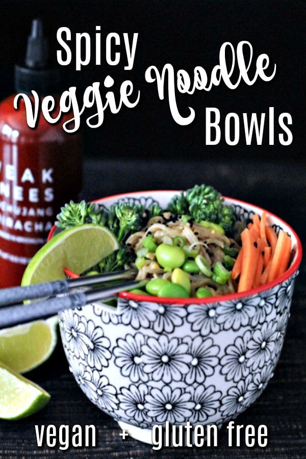 Spicy Peanut Veggie Noodle Bowl - noodles in a Japanese style ramen bowl, with carrots, edamame, broccoli, slice of lime. sriracha bottle in background