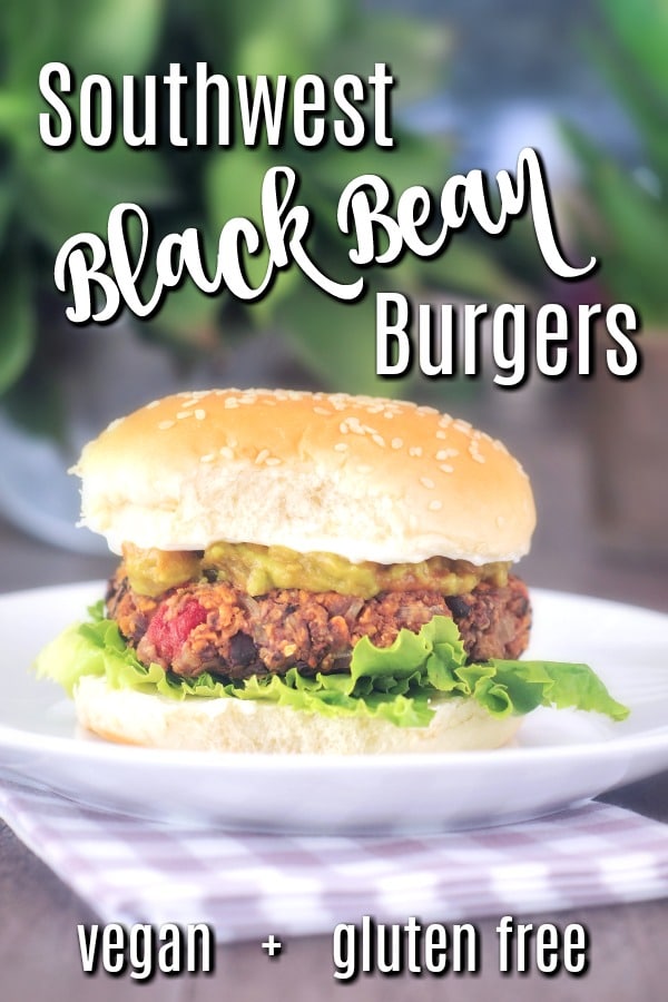 Southwest Black Bean Burger on a plate: bun, crisp green lettuce, veggie patty with salsa, guacamole, top bun with sesame seeds