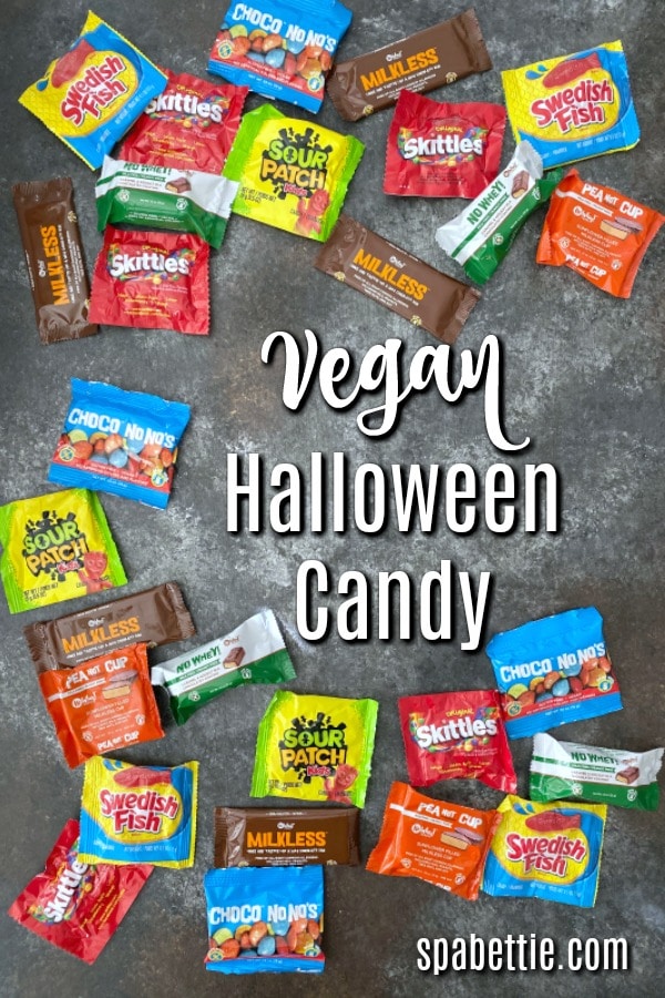 an assortment of Vegan Halloween Candy: Swedish Fish, Skittles, Sour Patch, PeaNOT Cups, Milkless Bar, Chocolates