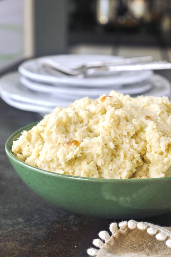 Mashed Cauliflower in a green serving bowl