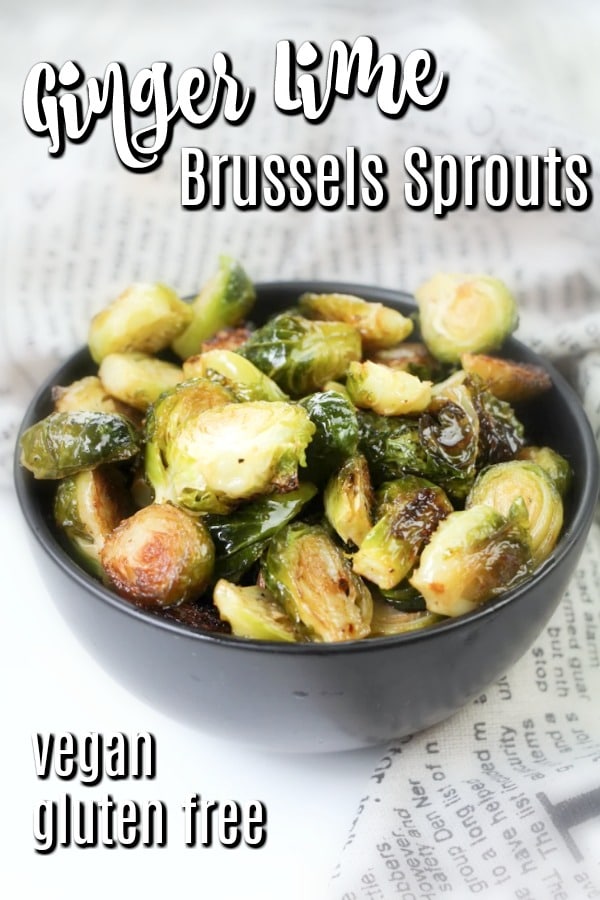 bright green Roasted Brussels Sprouts in a bowl with a newsprint napkin on the side