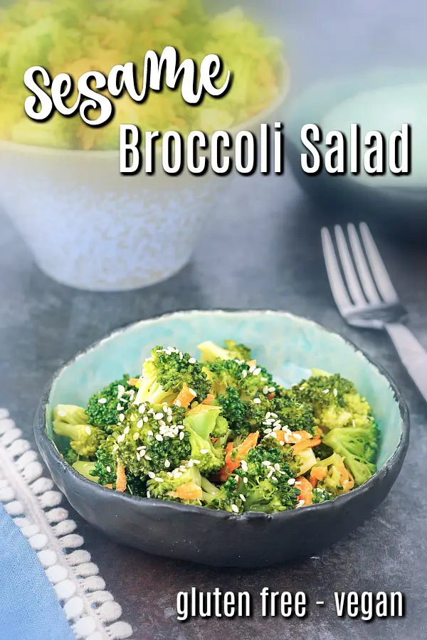 a serving of broccoli salad in a small rustic bowl. recipe uses broccoli, carrot, cashew cream, sesame oil, and maple syrup. also shows how to blanch broccoli