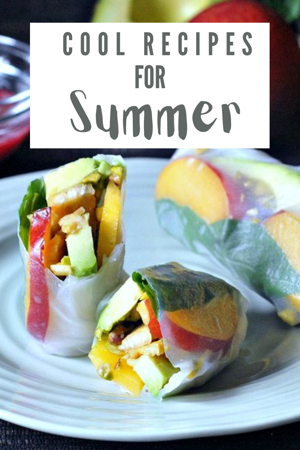 brightly colored summer rolls on a light blue plate (clear rice paper rolls with green avocado, red nectarine, yellow pepper). text across top of image reads "cool recipes for summer"