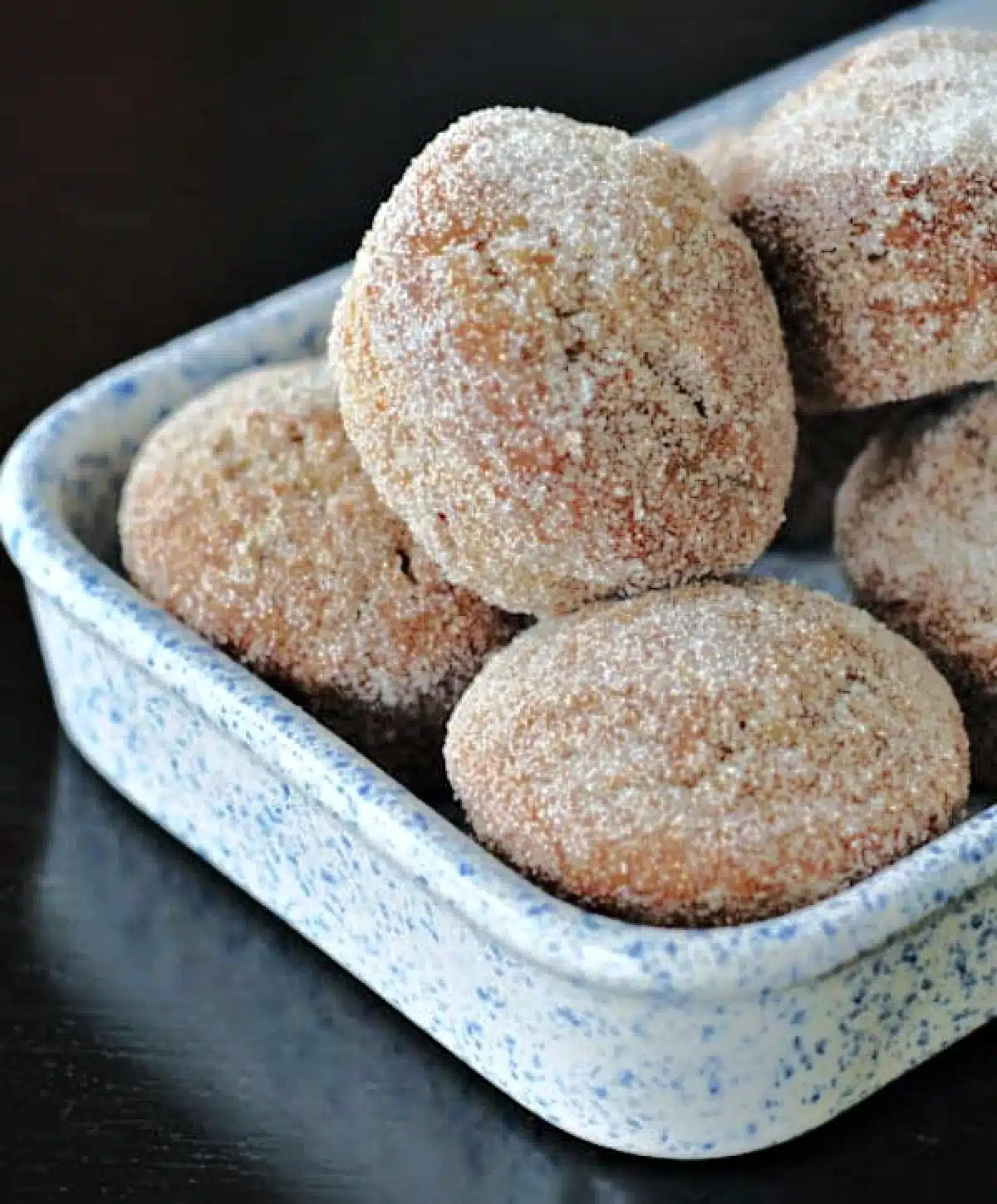 Sugar coated "donut muffins" in a shallow walled dish.