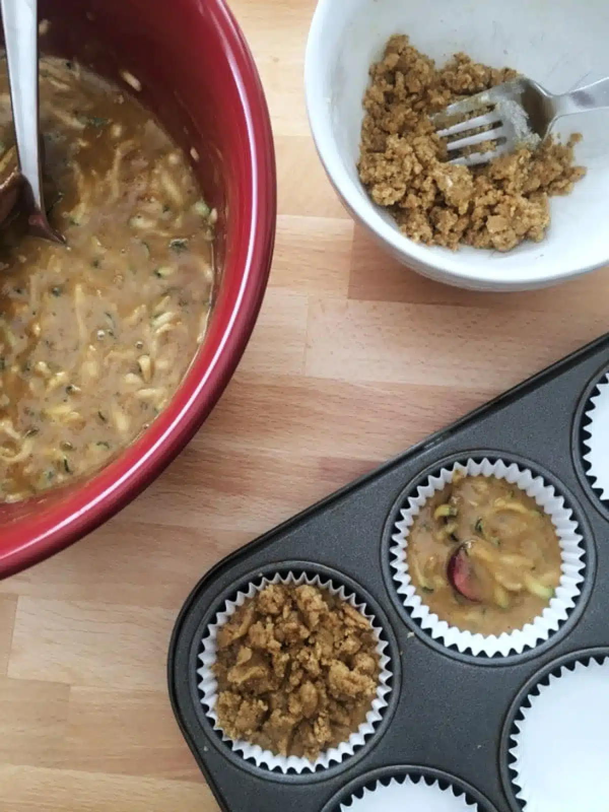 How to make cherry zucchini muffins: bowl of batter, batter scooped into muffin tins, crumb topping on top.