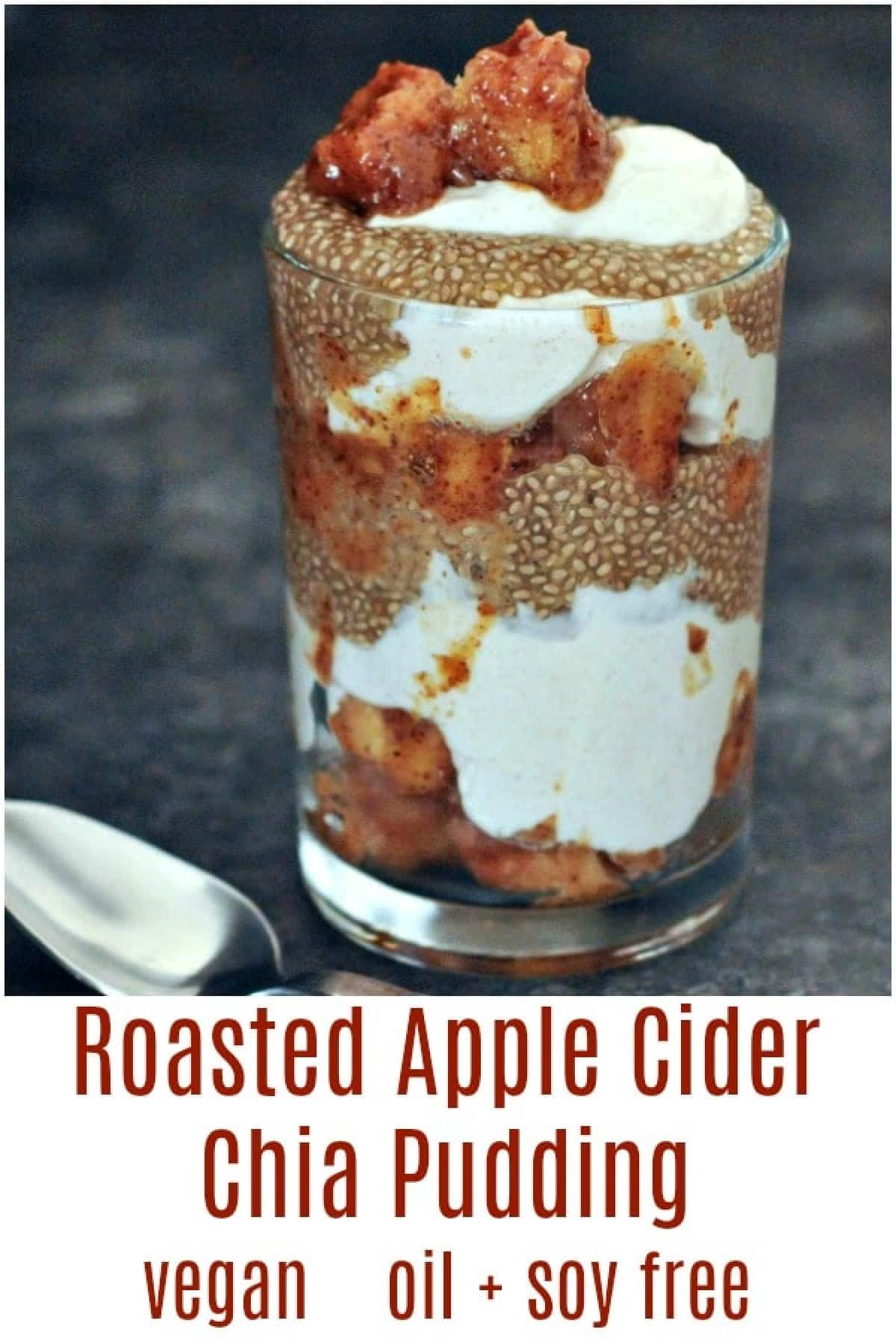 Roasted apples and chia pudding layered with yogurt and cubed apple in tall glass.