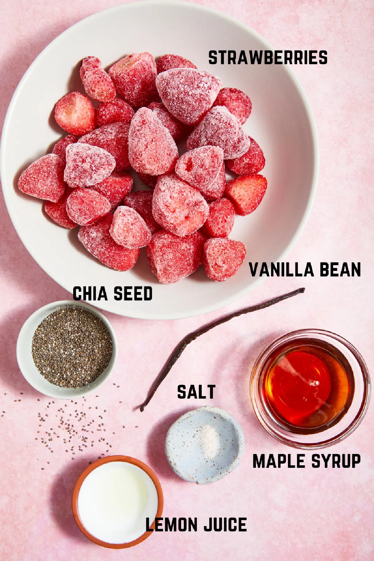 Ingredients to make strawberry chia jam: strawberries, vanilla bean, chia seed, salt, lemon juice, and maple syrup.